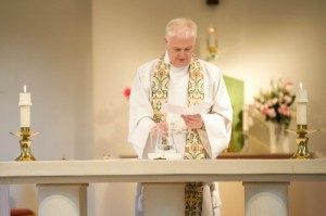 Baptism Father celebrating a Baptism at Holy Angels
